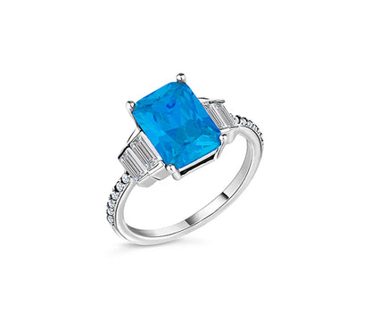 Diamond Style London - Aquamarine coloured ring in rhodium plating with c (Item code: Aquaring6)
