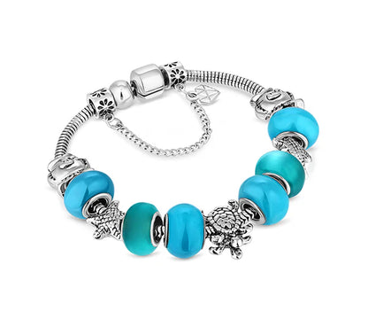 Diamond Style London - Charm Bracelet with Beach Charms and Pale Blue Bea (Item code: Charmbrabeach)
