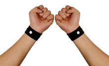 Load image into Gallery viewer, Travel Sickness Bands - Black or Pink